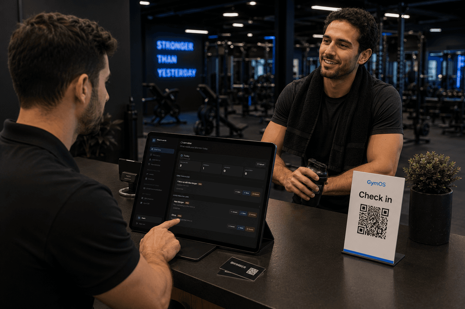 GymOS front desk sales operations dashboard with a member at reception