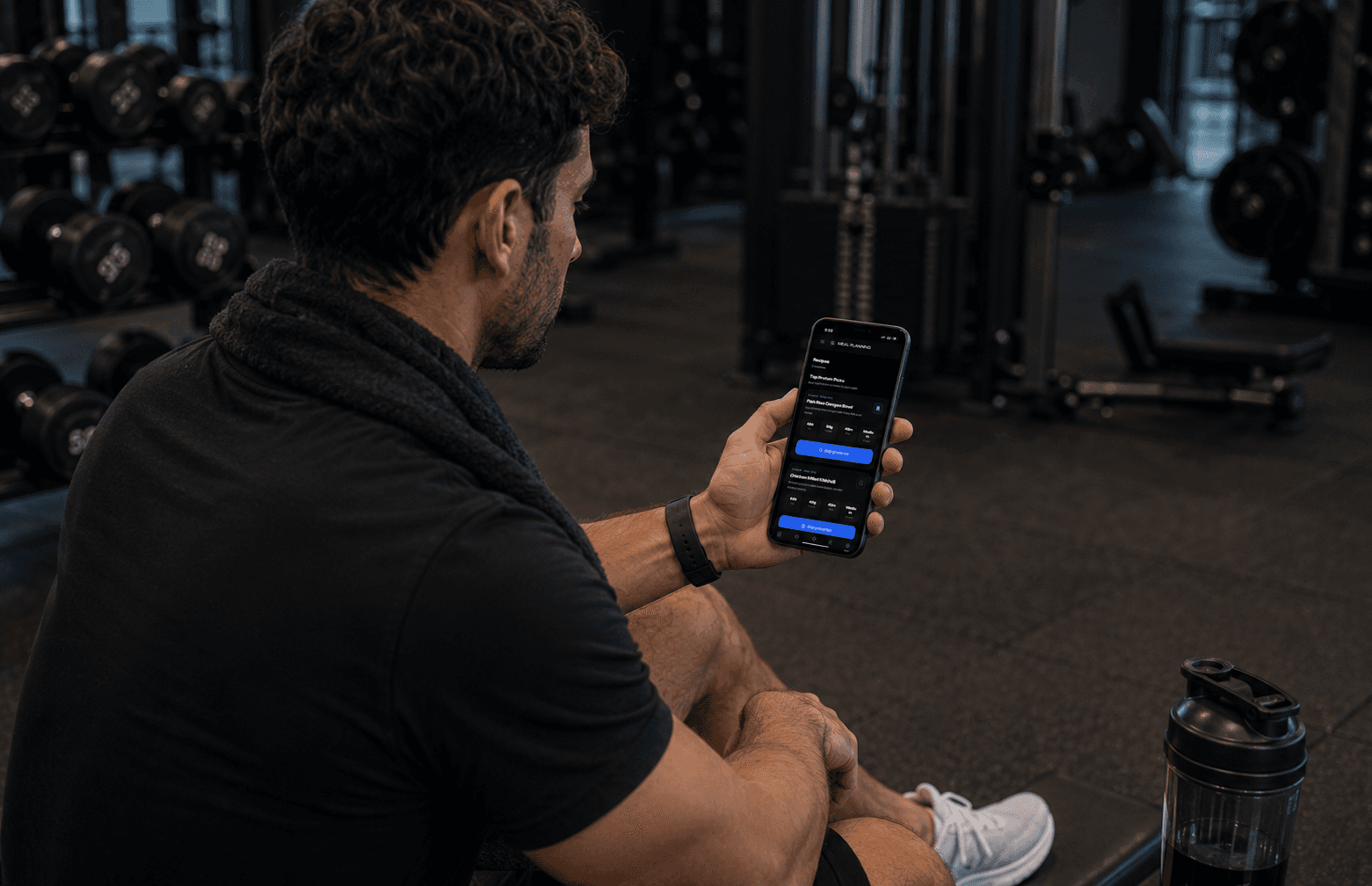 Gym member logging workout details on the GymOS mobile app after training